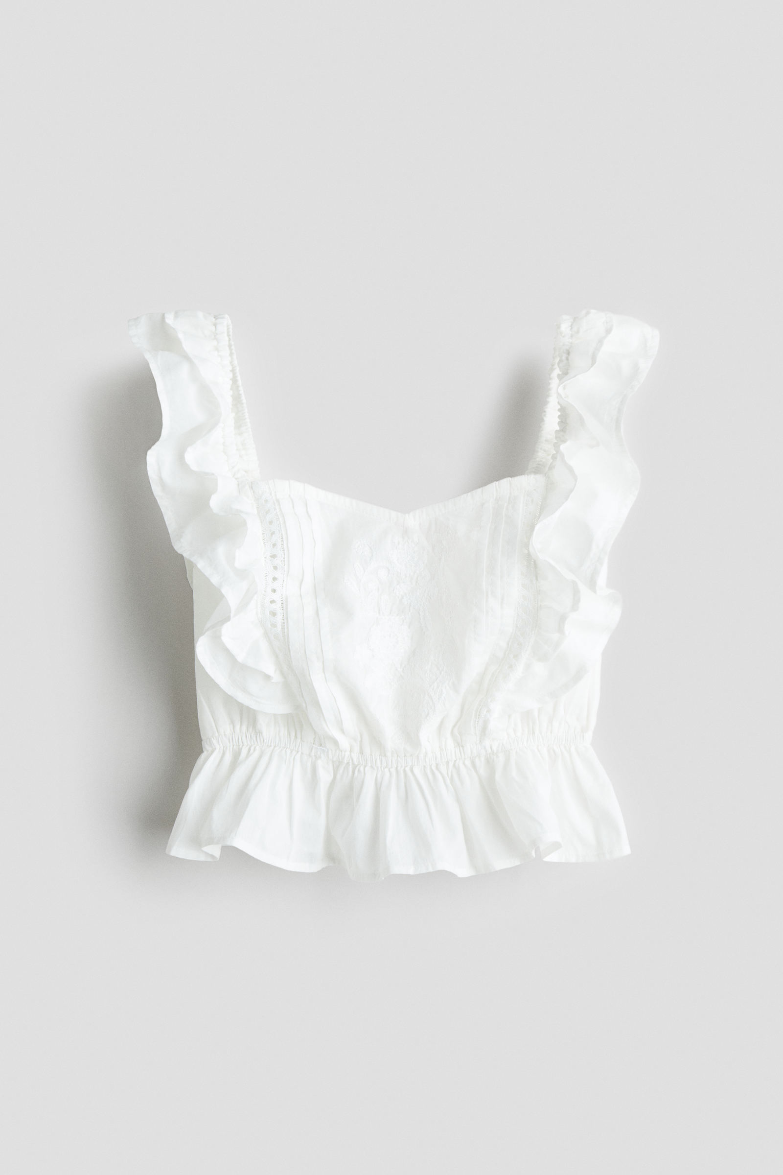 Top de algodón con mangas onduladas a $11.394